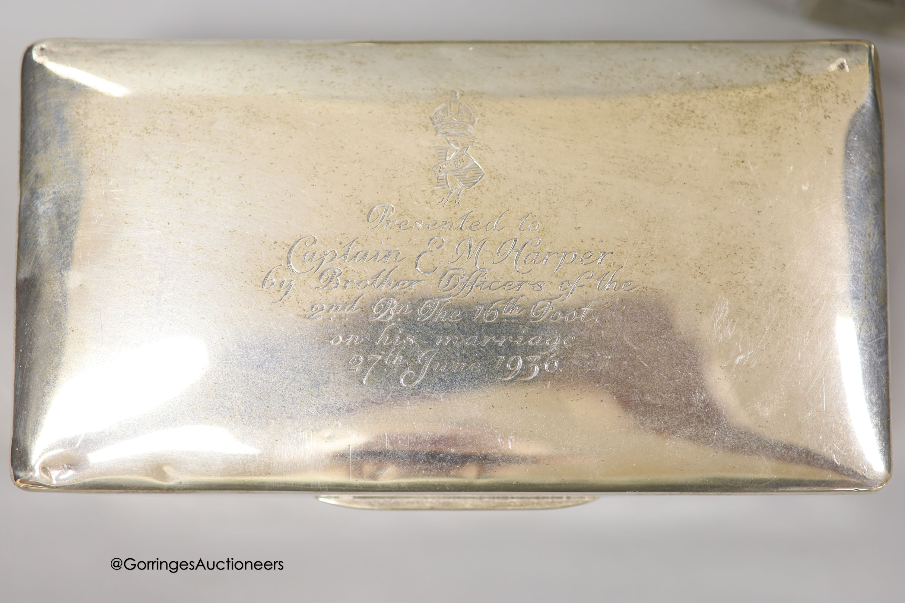 Three 20th century silver mounted cigarette boxes, two with engraved signatures, largest 16.2cm.